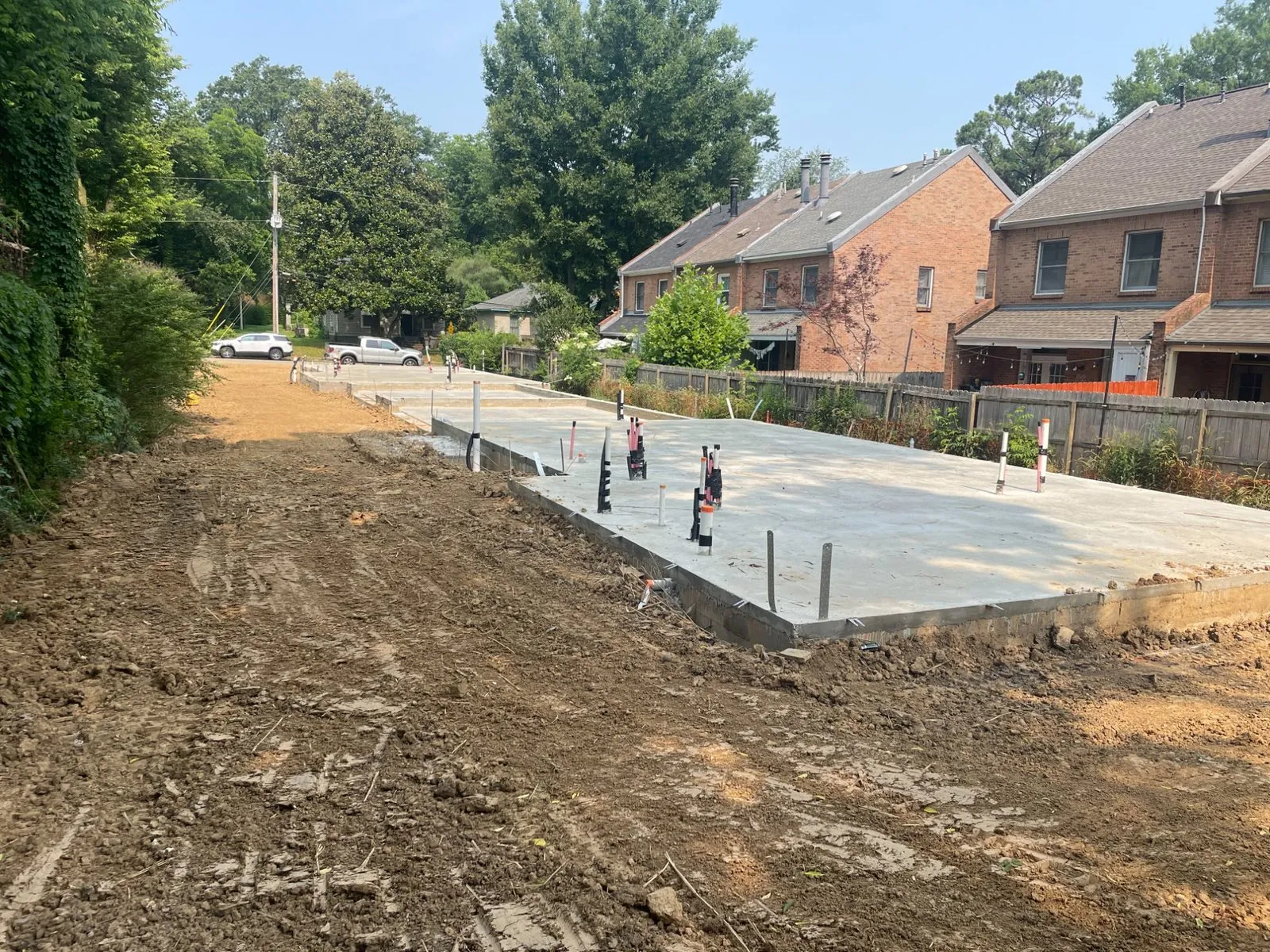 Poured concrete slab and stem wall completed on a residential lot before framing begins